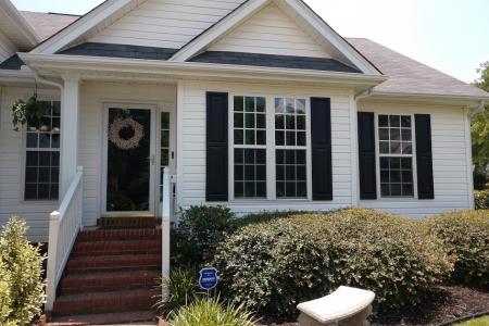 white vinyl siding residential building exterior window tinting