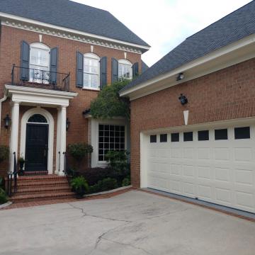 exterior garage residential window tinting on brick